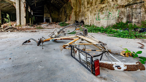 View of an abandoned cart against wall