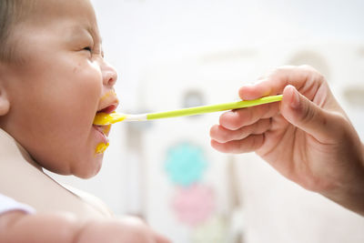 Close-up of boy eating