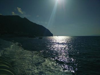 Scenic view of sea against sky on sunny day