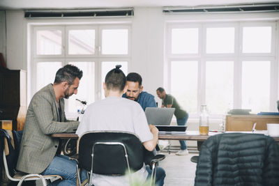 People sitting on table at home