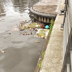 High angle view of garbage floating on lake
