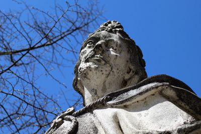 Low angle view of statue against clear blue sky