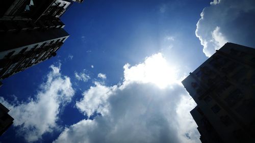 Low angle view of building against cloudy sky