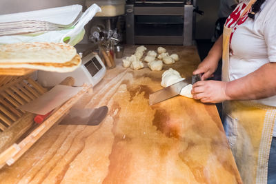 Midsection of man preparing food at home