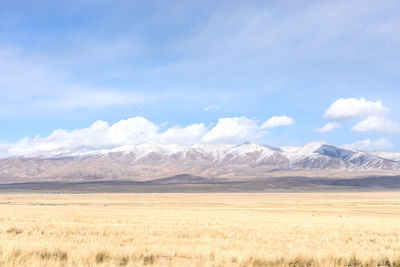 Scenic view of snowcapped mountains against sky