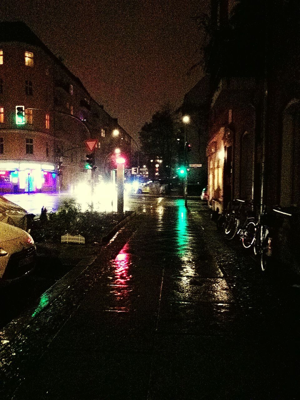 ROAD IN CITY DURING RAINY SEASON AT NIGHT