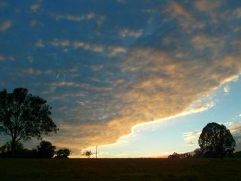 Scenic view of landscape against cloudy sky