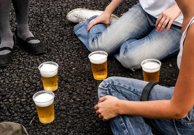 High angle view of friends with beer glasses