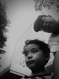 Portrait of mother and girl looking at camera