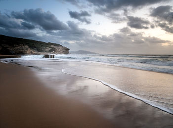 Cloudy sunset over funtanazza seashore in sardinia