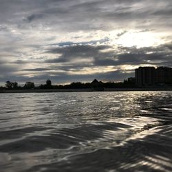 Scenic view of river against sky during sunset