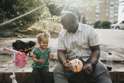 Father and daughter spending time actively outdoors