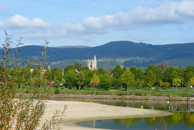 Reflection of trees and buildings in water