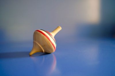 Close-up of colorful wooden spinning top on table