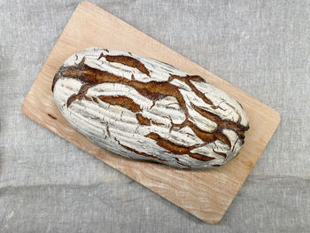 High angle view of bread on cutting board