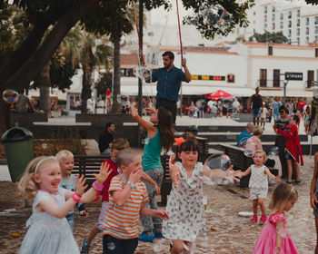 Group of people enjoying in city