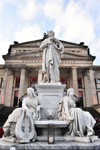 Low angle view of statue against building