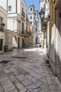 Footpath amidst buildings in town