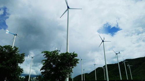 Low angle view of wind turbine against sky