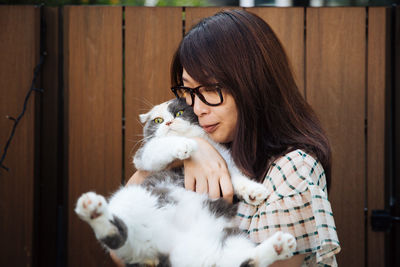 Portrait of woman with cat