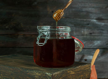 Close-up of drink in glass jar on table