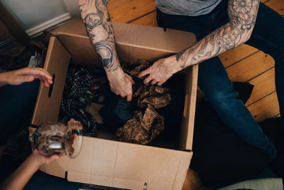 High angle view of people holding dog