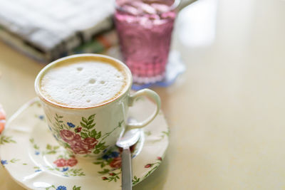 Close-up of coffee cup on table