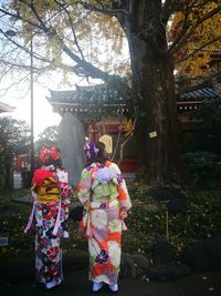 People on tree trunk