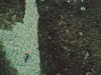 Aerial view of woman standing at beach