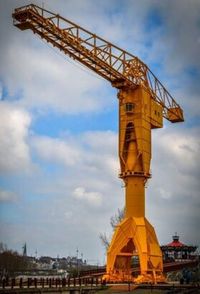 Low angle view of built structure against cloudy sky