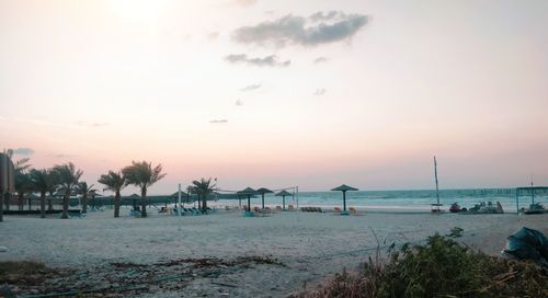 Scenic view of beach against sky during sunset