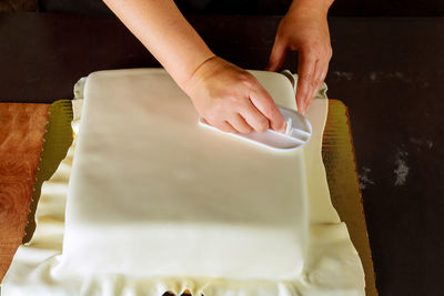 Midsection of person preparing food on table