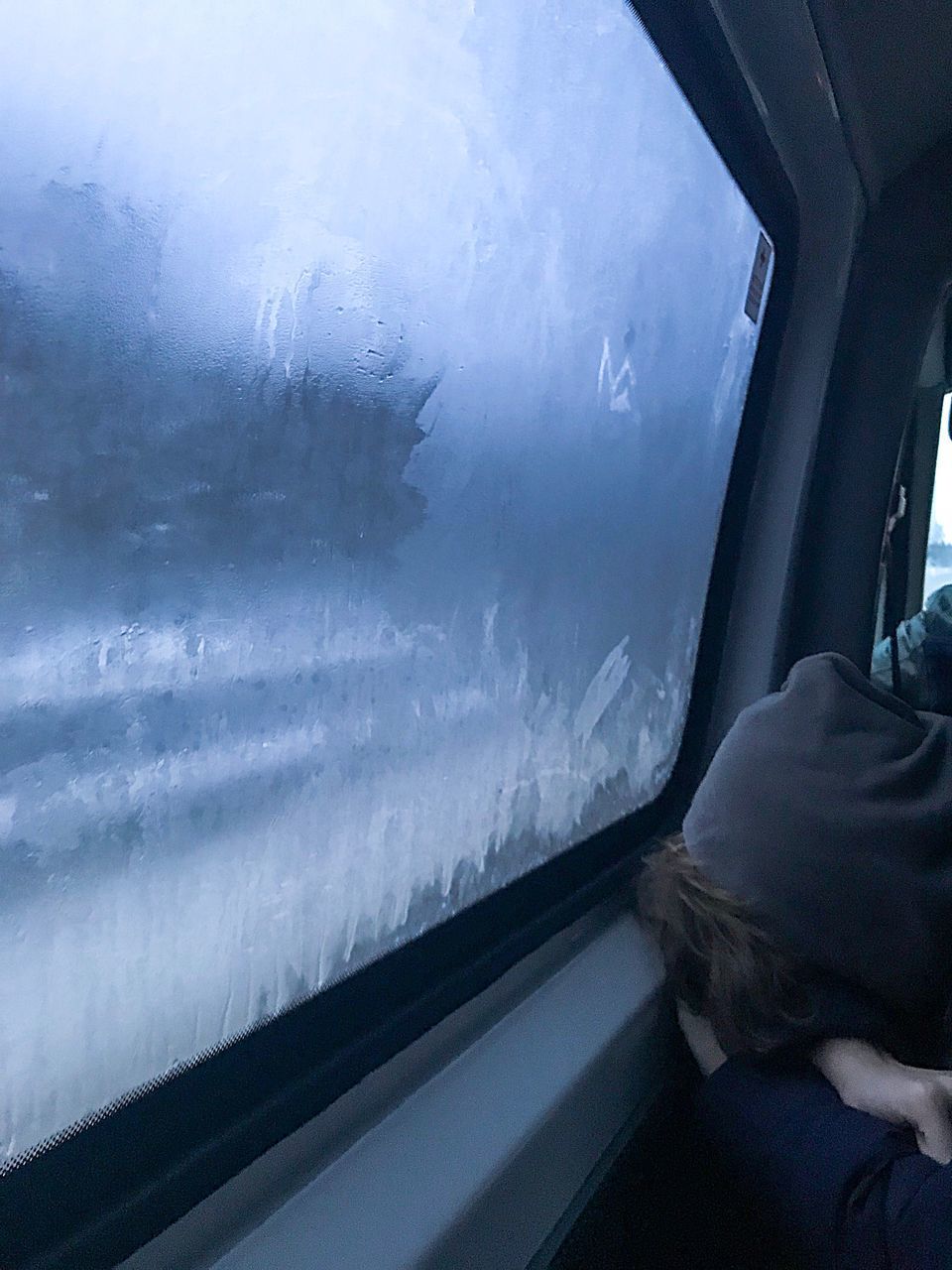 VIEW OF TRAIN THROUGH WINDOW OF CAR