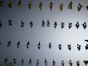 Low angle view of decoration hanging against clear sky