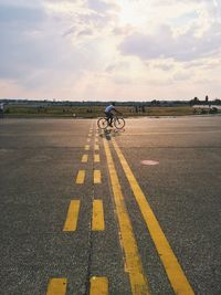 View of road against cloudy sky