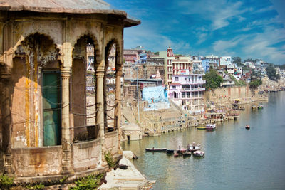 Wide angle top view of banaras cityscape ghat next to ganges river and an indian style dome balcony