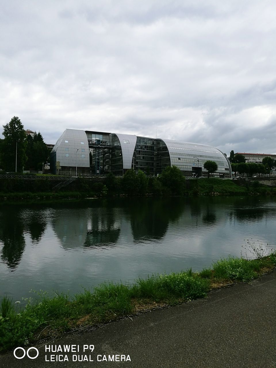 VIEW OF RIVER AGAINST CLOUDY SKY