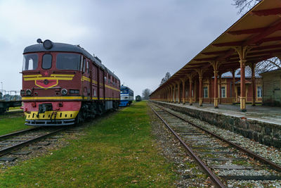 Train on railroad track against sky