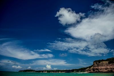 Scenic view of sea against cloudy sky