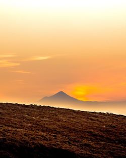 Scenic view of mountains at sunset