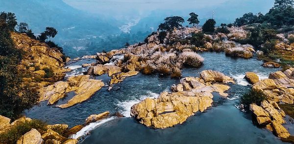 High angle view of rocks by river