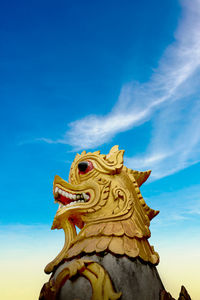 Golden lion sculpture with beautiful sky on the mountain in phra that doi kong mu thailand
