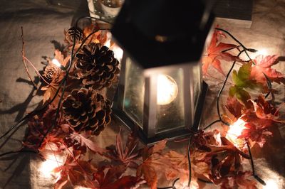 Close-up of illuminated lantern on table