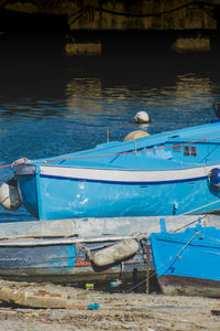 Boats moored at sea shore