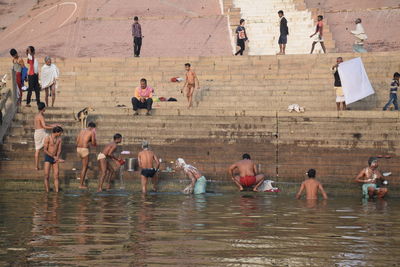 Group of people relaxing on water