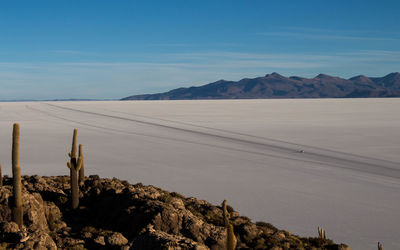 Scenic view of arid landscape against sky