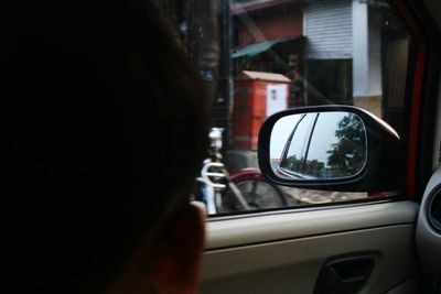 Close-up of side-view mirror of car