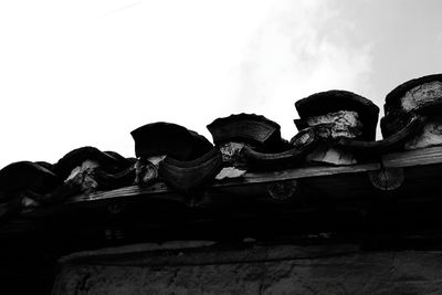 Low angle view of statue against sky