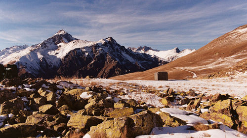 Scenic view of snowcapped mountains against sky