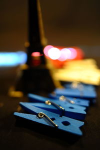 Close-up of illuminated light bulb on table